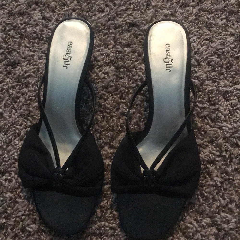 Black heels with a bow on them